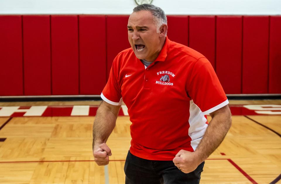 Freedom head coach John Kaercher is excited after the Bulldogs win over North Catholic in the 2022 PIAA semifinal.