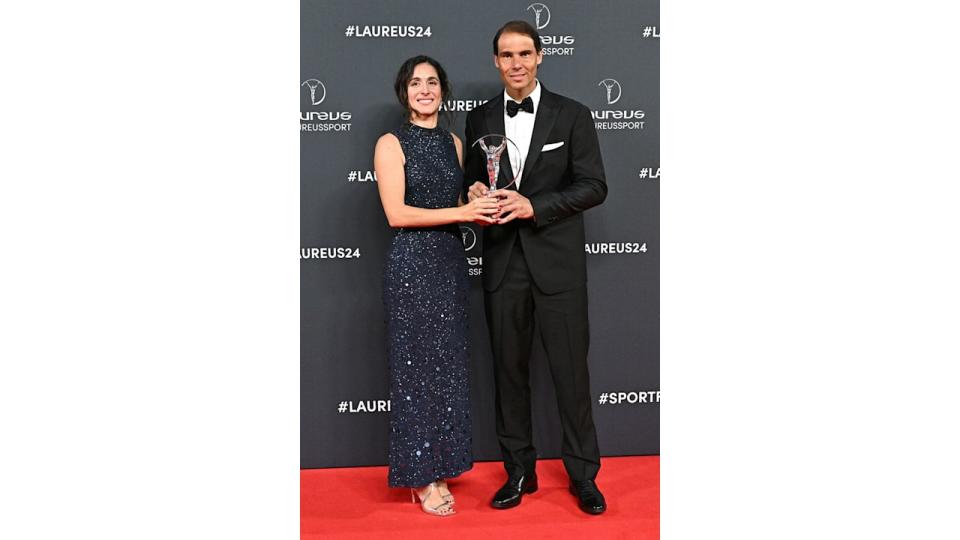Rafa Nadal and wife Maria Francisca Perello hold award