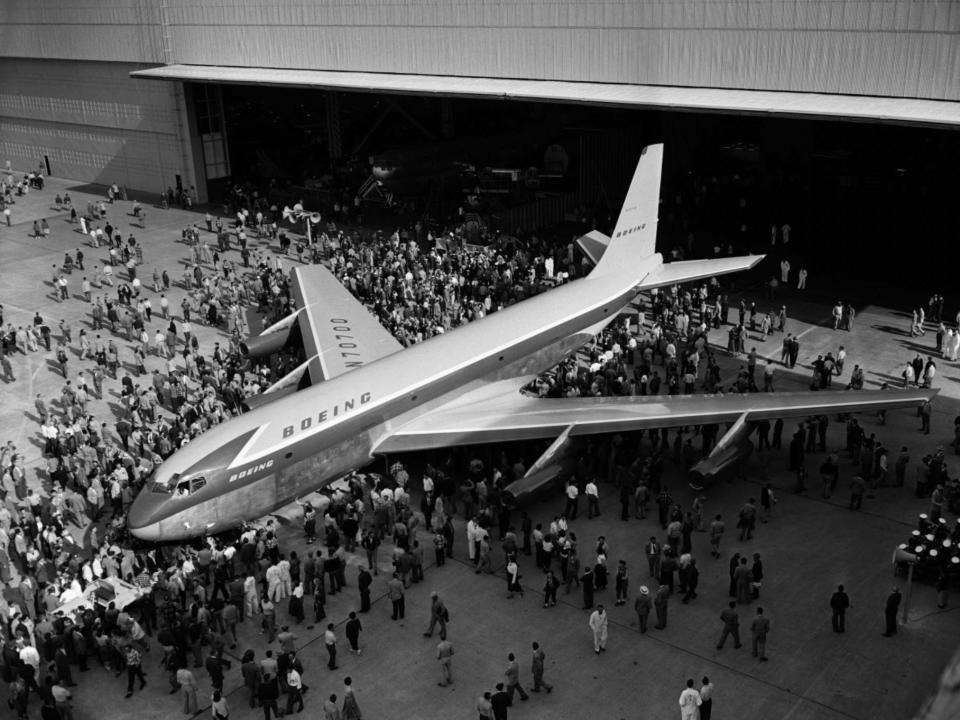 The first Boeing 707 rolling off the assembly line in May 1954.