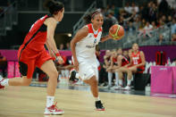 LONDON, ENGLAND - JULY 30: Jenaya Wade-Fray #9 of Great Britain dribbles versus Canada at the Olympic Park Basketball Arena during the London Olympic Games on July 30, 2012 in London, England. NOTE TO USER: User expressly acknowledges and agrees that, by downloading and/or using this Photograph, user is consenting to the terms and conditions of the Getty Images License Agreement. Mandatory Copyright Notice: Copyright 2012 NBAE (Photo by Garrett W. Ellwood/NBAE via Getty Images)