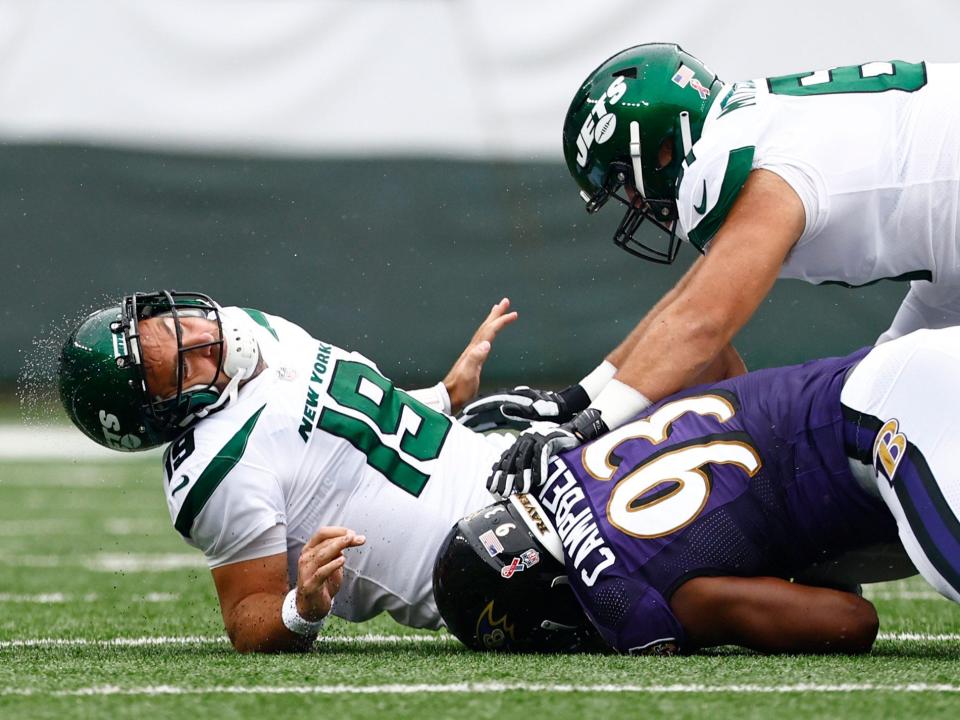 Joe Flacco is sacked by the Baltimore Ravens defense.