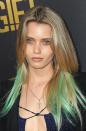 How the Aussie model pulled off green hair, no make up and dark rings around the eyes at the premiere of <i>The Gift</i> in Los Angeles baffles us! She completed the sexy grunge look off with a nose ring, and blinged things up a bit with those big gold hoop earrings under that silky mane.