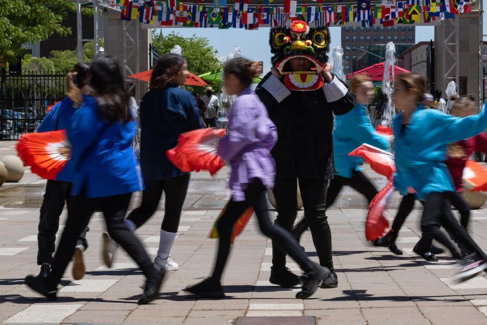 Red Phoenix Rising performs the fan dance during Stockton Flavor Fest on Saturday, May 20, 2023, at Weber Point. The event had culinary vendors, food trucks, entertainment, performances, kids activities, craft beers and more.