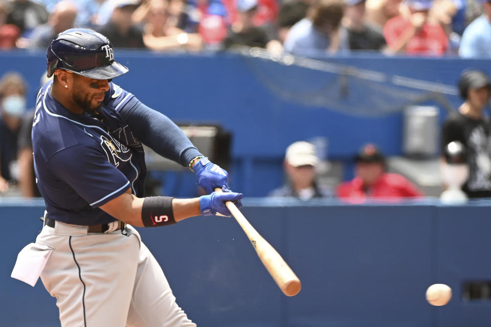 Tampa Bay Rays' Wander Franco hits an RBI single scoring Taylor Walls during the eighth inning of a baseball game against the Toronto Blue Jays, Saturday, July 2, 2022 in Toronto. (Jon Blacker/The Canadian Press via AP)