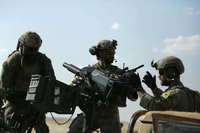 US special operations forces, photographed in Syria on May 25, 2016, wearing the insignia of Kurdish troops have been ordered to remove the patches