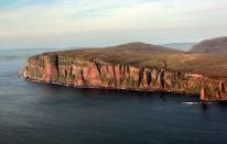 <p>Take a ferry from the Scottish mainland to visit Hoy, which has dramatic coastlines. Hoy has a huge and varied bird life, along with several landmarks like the Dwarfie Stane, a rock-cut tomb. Fun fact: The 1984 video for the Eurythmics' "Here Comes the Rain Again" was shot here. </p>