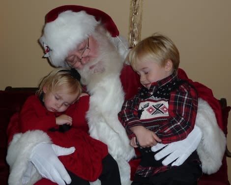 <div class="caption-credit"> Photo by: MOMMBY</div><p> "Our two-year-old daughter loves waving to Santa from afar, but I was not sure we would be able to get her picture on Santa's lap. On our first attempt, she ran away screaming. The solution was to wait in line for over an hour, and by the time it was our turn to see Santa, she had just fallen asleep. Santa had the great idea to put her on his lap and have him and our four year old pretend to also be sleeping." - MOMMBY, <a href="http://voices.yahoo.com/two-year-old-fell-asleep-santas-lap-11918649.html?cat=25" data-ylk="slk:Two Year Old Fell Asleep on Santa's Lap;elm:context_link;itc:0;sec:content-canvas;outcm:mb_qualified_link;_E:mb_qualified_link;ct:story;" class="link  yahoo-link">Two Year Old Fell Asleep on Santa's Lap</a> </p>