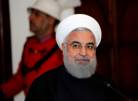 FILE PHOTO: Iranian President Hassan Rouhani speaks during a news conference with Iraq's President Barham Salih (not pictured) at Salam Palace in Baghdad, Iraq March 11, 2019. REUTERS/Thaier al-Sudani/File Photo