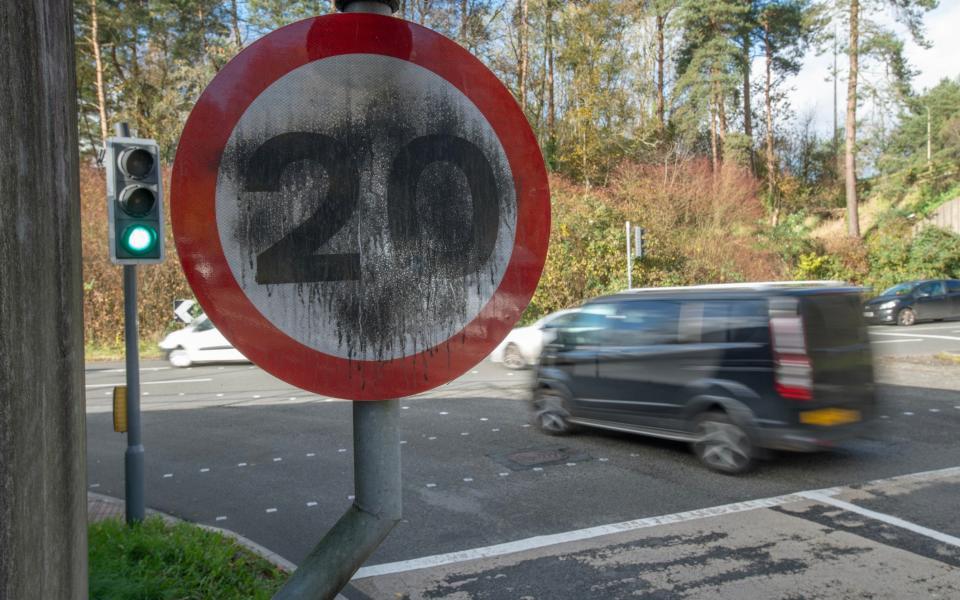 A vandalised 20mph speed limit sign in Treherbert, Wales