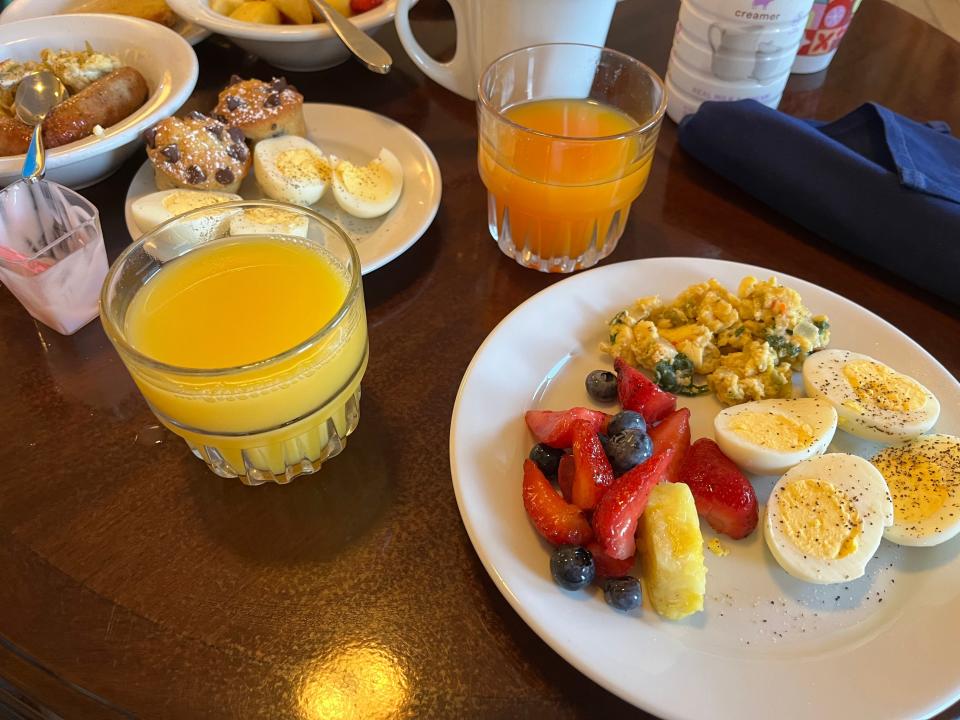 glasses of juice and plates of continental breakfast from the club lounge at disney's beach club resort