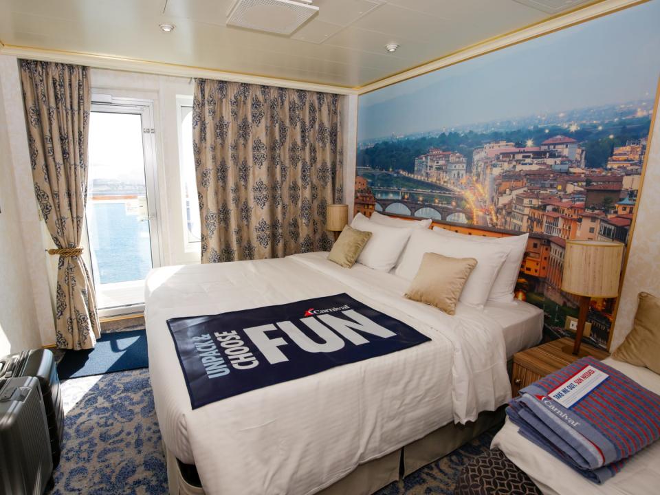 bed in balcony cabin on Carnival Firenze