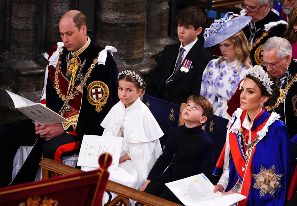 Prince Louis next to his mom and sister in church
