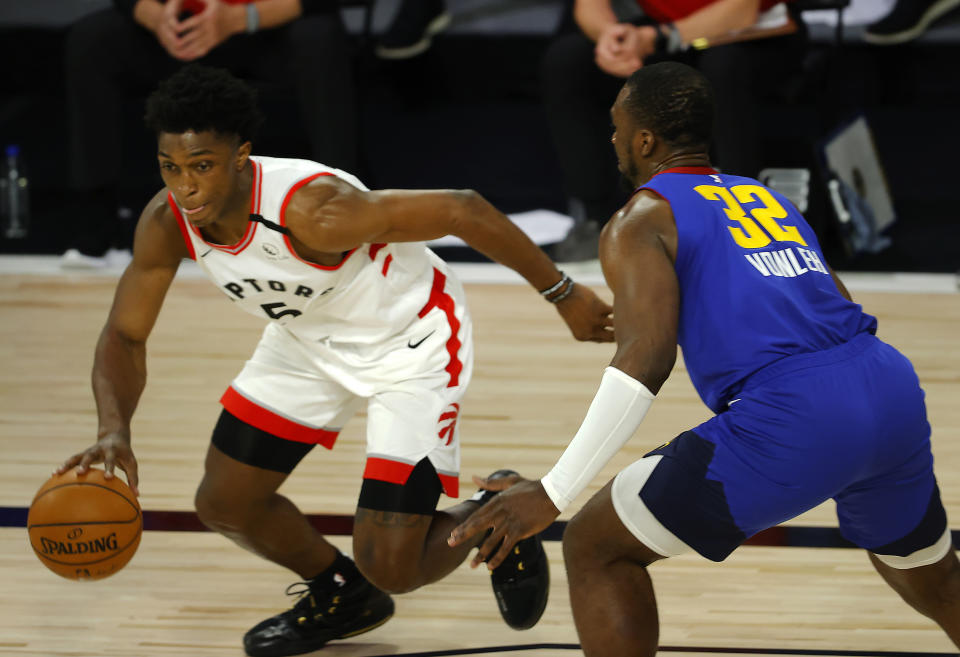 Toronto Raptors' Stanley Johnson (5) drives against Denver Nuggets' Noah Vonleh (32) during the fourth quarter of an NBA basketball game Friday, Aug. 14, 2020, in Lake Buena Vista, Fla. (Mike Ehrmann/Pool Photo via AP)