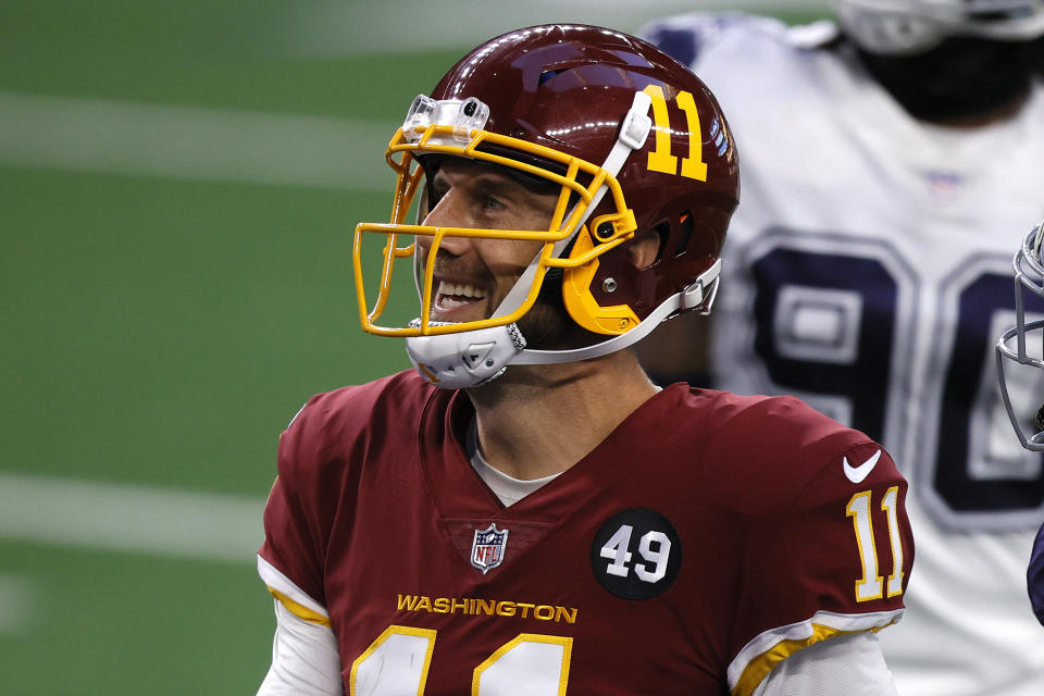 ARLINGTON, TEXAS - NOVEMBER 26: Alex Smith #11 of the Washington Football Team reacts during the second quarter of a game against the Dallas Cowboys at AT&T Stadium on November 26, 2020 in Arlington, Texas. (Photo by Tom Pennington/Getty Images)