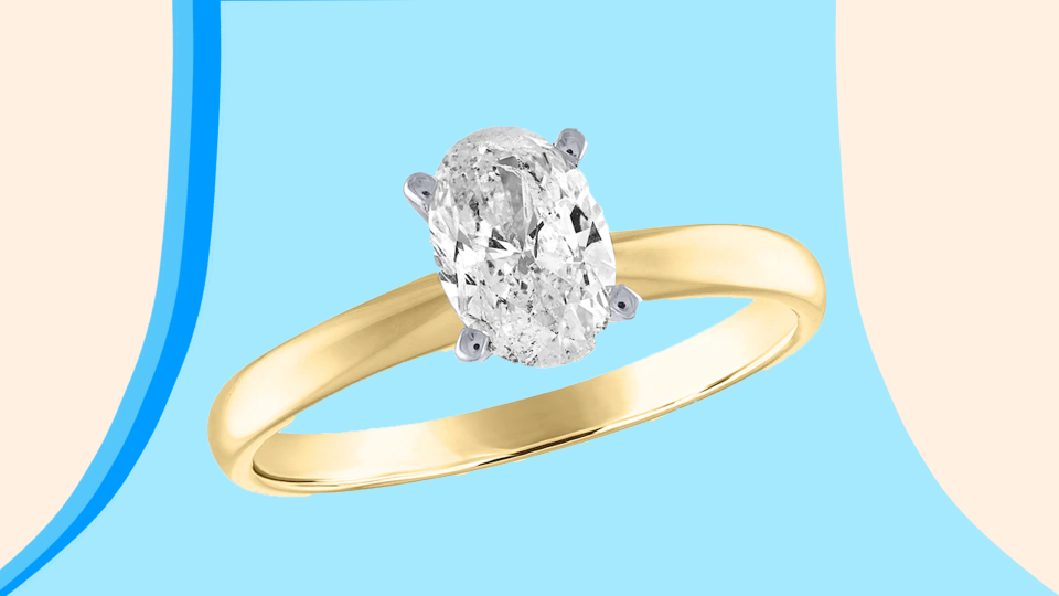 This classic oval-shaped ring is paired with a 14k gold band.