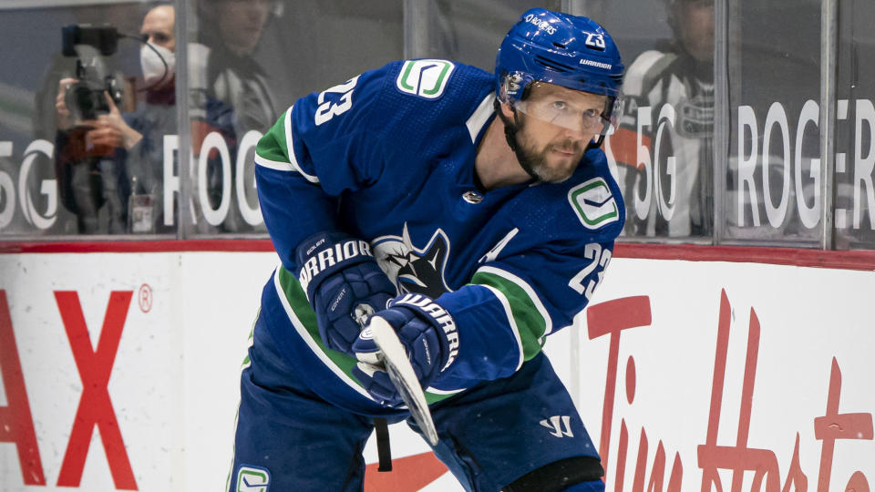 VANCOUVER, BC - MARCH 08:  Alex Edler #23 of the Vancouver Canucks shoots the puck during NHL hockey action against the Montreal Canadiens at Rogers Arena on March 8, 2021 in Vancouver, Canada. (Photo by Rich Lam/Getty Images)