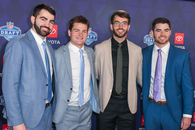 <p>Aaron J. Thornton/Getty</p> Drake Maye (second to left) with his brothers at the NFL Draft