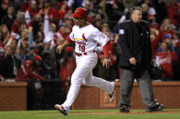 ST LOUIS, MO - OCTOBER 27: Jon Jay #19 of the St. Louis Cardinals celebrates after scoring on a game-tying RBI single by Lance Berkman #12 in the 10th inning during Game Six of the MLB World Series against the Texas Rangers at Busch Stadium on October 27, 2011 in St Louis, Missouri. (Photo by Jamie Squire/Getty Images)