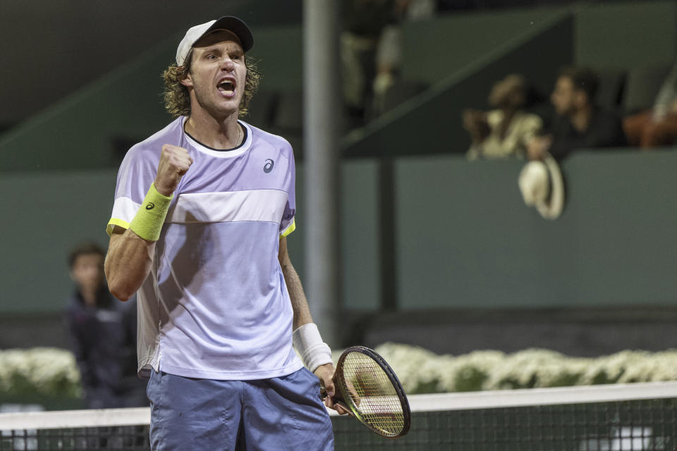 Nicolas Jarry of Chile reacts after winning a game against Casper Ruud of Norway during their quarter-final match at the Geneva Open tennis tournament in Geneva, Switzerland, Thursday, May 25, 2023. (Martial Trezzini/Keystone via AP)