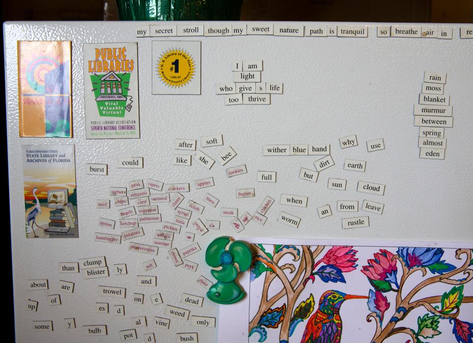Art and word games decorate a refrigerator in the common area of Everyone Village.
