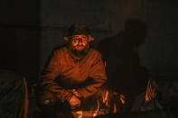 In this photo provided by Azov Special Forces Regiment of the Ukrainian National Guard Press Office, A Ukrainian soldier inside the ruined Azovstal steel plant takes a rest in his shelter in Mariupol, Ukraine, May 10, 2022. For nearly three months, Azovstal’s garrison clung on, refusing to be winkled out from the tunnels and bunkers under the ruins of the labyrinthine mill. A Ukrainian soldier-photographer documented the events and sent them to the world. Now he is a prisoner of the Russians. His photos are his legacy.(Dmytro Kozatsky/Azov Special Forces Regiment of the Ukrainian National Guard Press Office via AP)