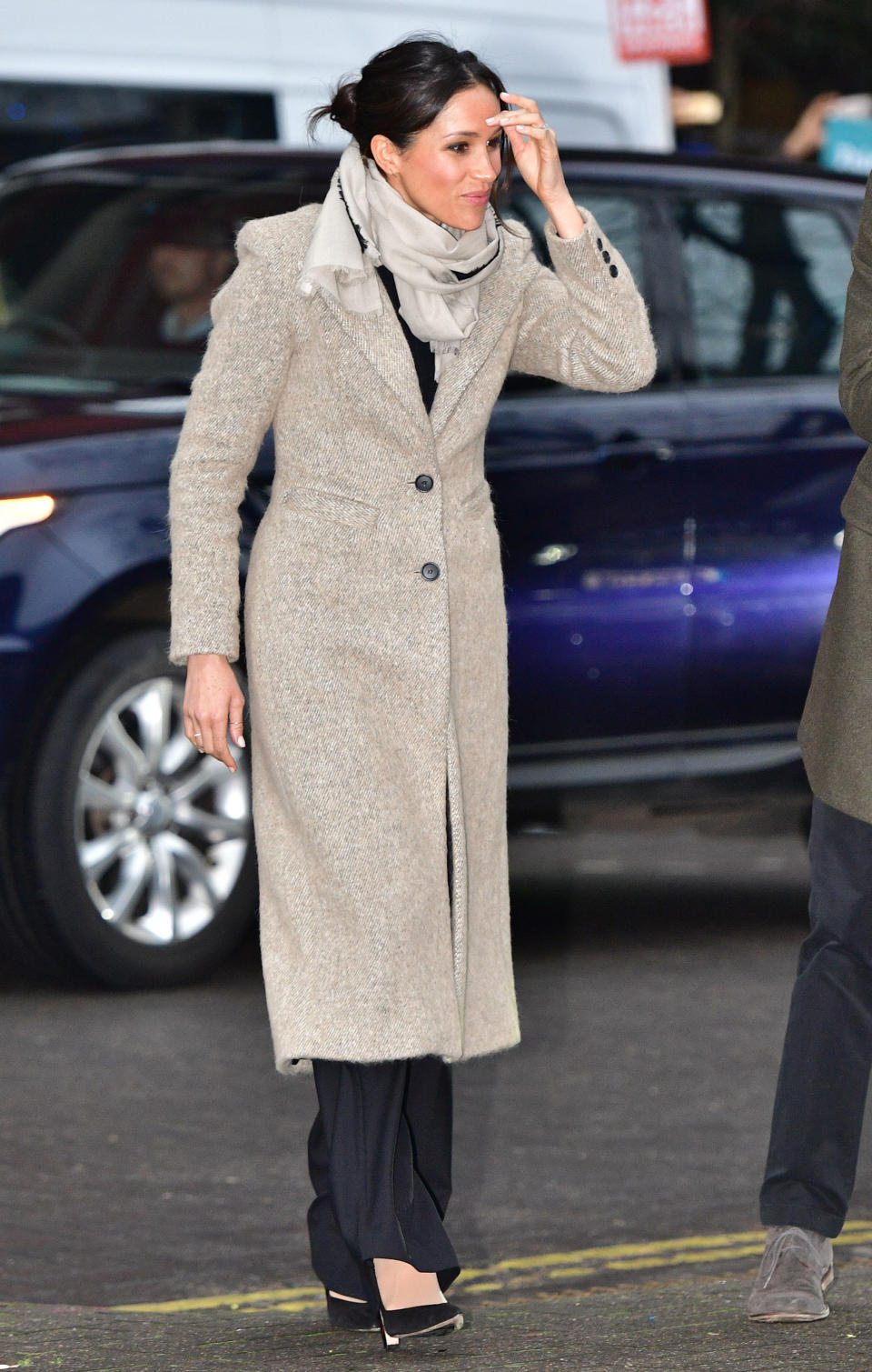 <p>On 9 January 2018, Meghan Markle and Prince Harry visited a Brixton radio station to mark their second royal engagement together. For the momentous occasion, Markle recycled her go-to Smythe coat and teamed the look with Burberry trousers, a Jigsaw scarf and Marks and Spencer’s <a rel="nofollow noopener" href="http://www.marksandspencer.com/wool-blend-round-neck-bell-sleeve-jumper/p/p22511692?OmnitureRedirect=Wool+Blend+Round+Neck+Bell+Sleeve+Jumper+" target="_blank" data-ylk="slk:knit;elm:context_link;itc:0;sec:content-canvas" class="link ">knit</a>. <em>[Photo: Getty]</em> </p>