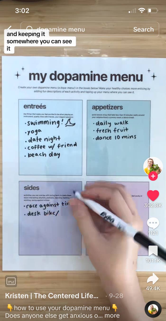 woman filling in a dopamine menu worksheet with a marker