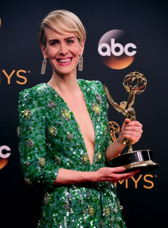Sarah Paulson dazzled in a beaded emerald green Prada gown opened to her navel