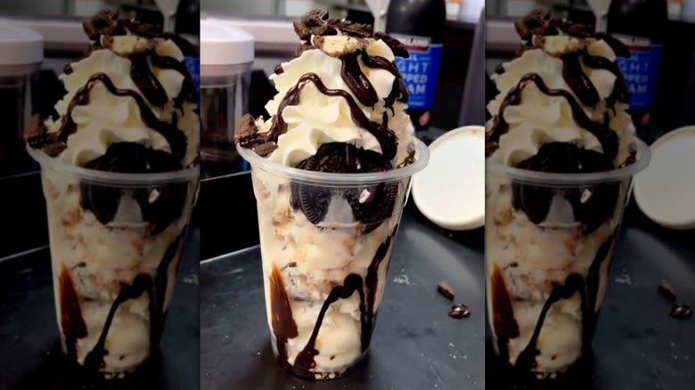 Oreo milkshake with toppings on counter