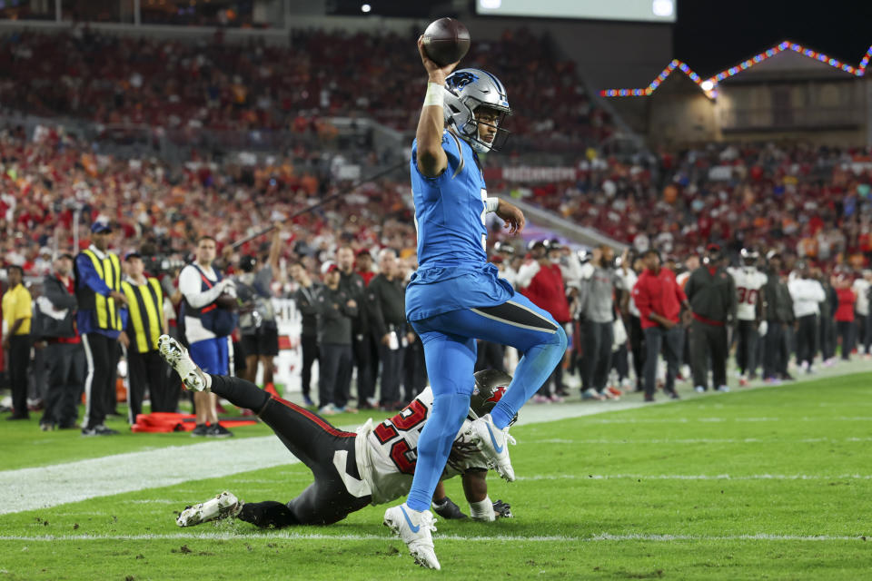 Carolina Panthers quarterback Bryce Young celebrates after scoring a two point conversion past Tampa Bay Buccaneers safety Ryan Neal during the second half of an NFL football game Sunday, Dec. 3, 2023, in Tampa, Fla. (AP Photo/Mark LoMoglio)