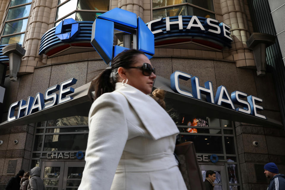 A woman passes by a Chase bank in Times Square in New York City, U.S., March 7, 2019. REUTERS/Brendan McDermid