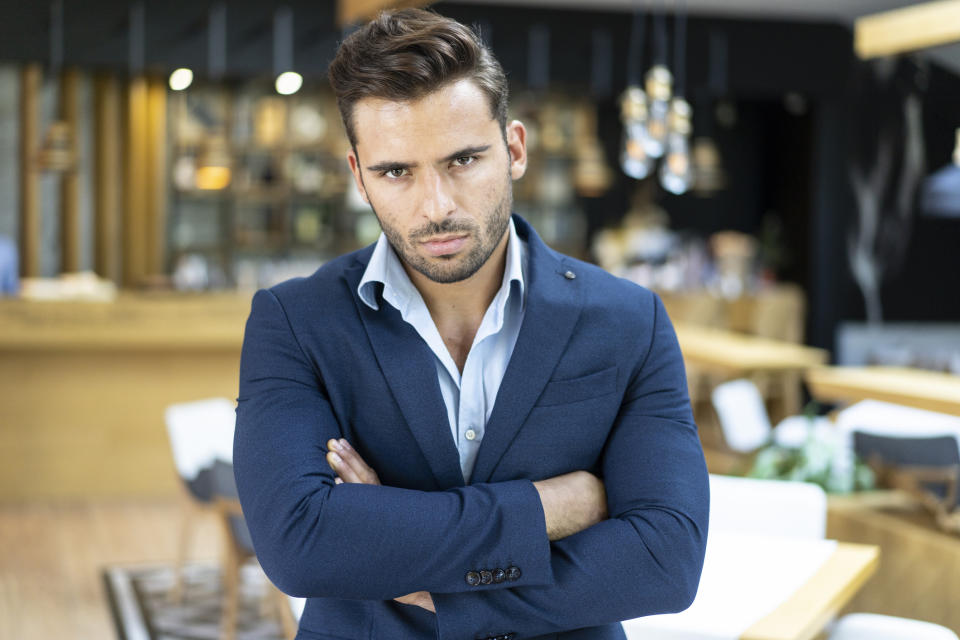 An angry-looking man in a suit