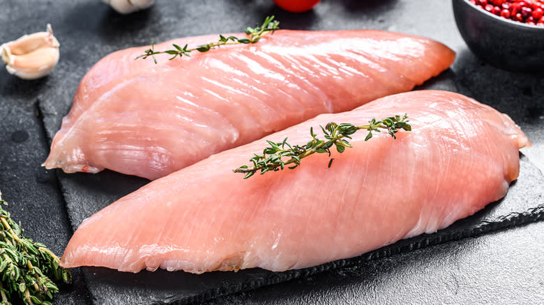 Raw turkey breasts with thyme
