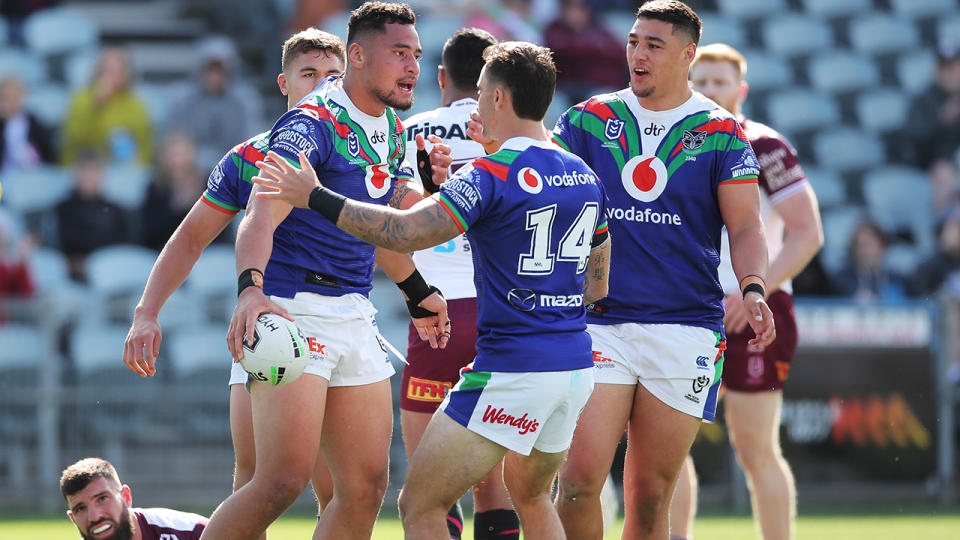 Warriors players, pictured here celebrating a try during the 2020 NRL season.