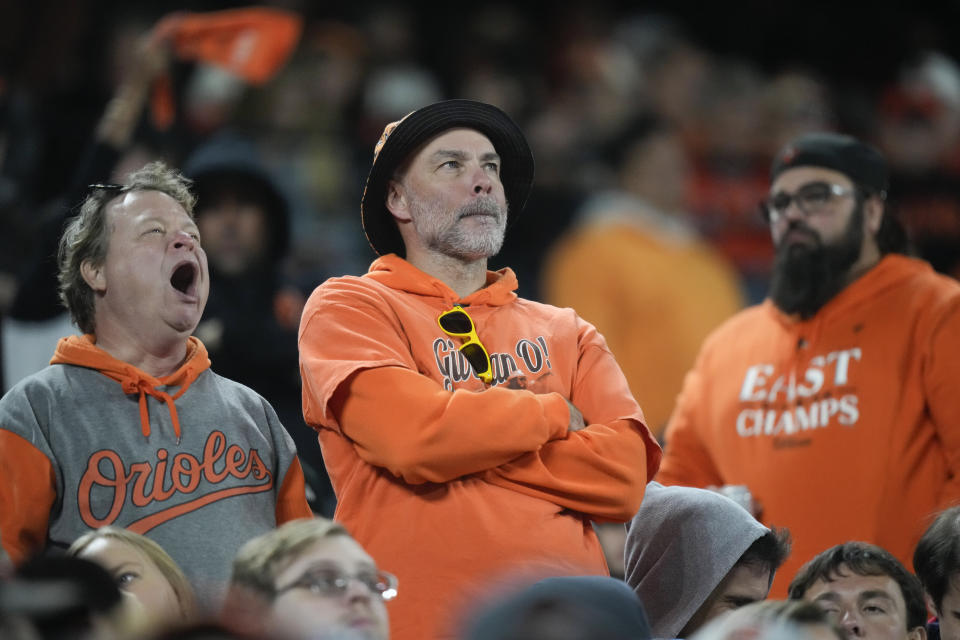 Baltimore Orioles fans look on during the eighth inning in Game 2 of an American League Division Series baseball game against the Texas Rangers, Sunday, Oct. 8, 2023, in Baltimore. (AP Photo/Alex Brandon)