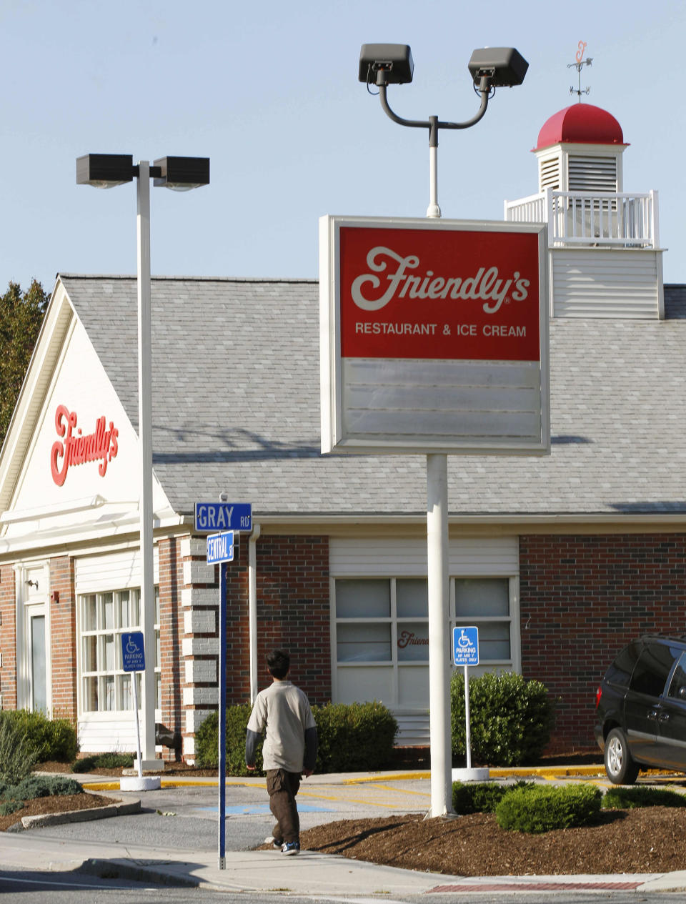 A boy walks past the Friendly's restaurant in Foxborough, Mass., Wednesday, Oct. 5, 2011.  The parent of the Massachusetts-based Friendly's restaurant chain filed for Chapter 11 bankruptcy  protection on Wednesday and said that it has already closed 63 of its stores. Each store employed about 20 people, so about 1,260 jobs were lost. (AP Photo/Charles Krupa)
