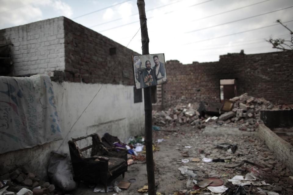 This Thursday, March 14, 2013 photo, shows damaged houses of Christian families by an angry Muslim mob in a Christian neighborhood, in Lahore. Pakistan’s blasphemy law has become a potent weapon in the arsenal of Muslim extremists, who use it against adherents of minority religions. (AP Photo/Nathalie Bardou)