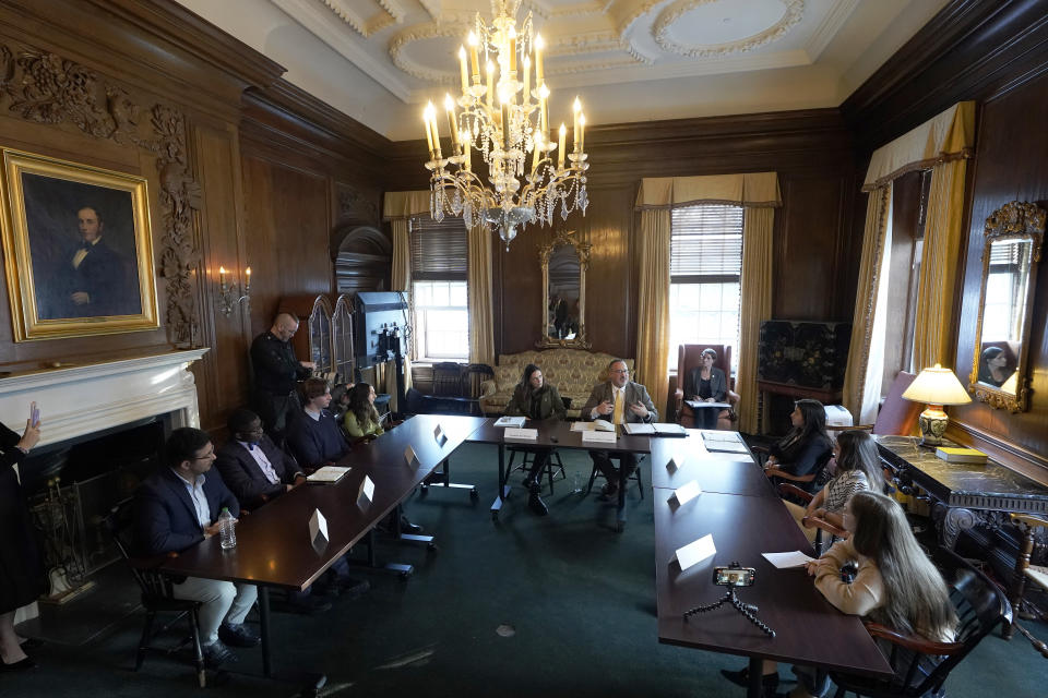 Dartmouth College President Sian Leah Beilock, center left, and U.S. Education Secretary Miguel Cardona, center right, participate in a roundtable discussion with Dartmouth College students, on the school's campus, Wednesday, Jan. 10, 2024, in Hanover, N.H. Fallout from the Israel-Hamas war has roiled campuses across the U.S. and reignited a debate over free speech. (AP Photo/Steven Senne)