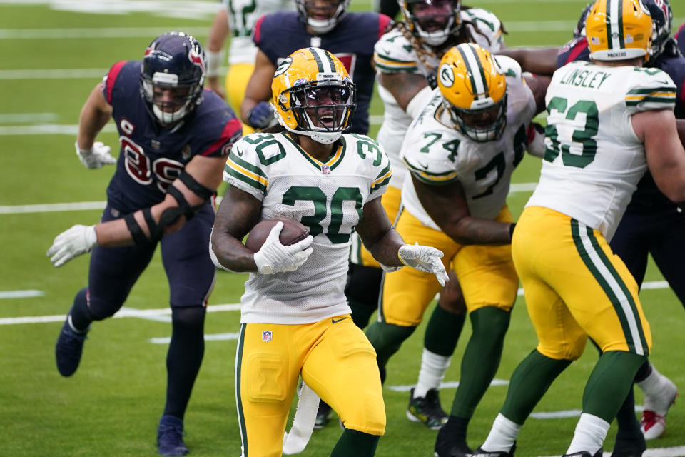 Green Bay Packers running back Jamaal Williams (30) scores during the second half of an NFL football game against the Houston Texans Sunday, Oct. 25, 2020, in Houston. (AP Photo/Sam Craft)