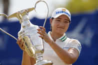 Mirim Lee, of South Korea, holds the championship trophy after winning the LPGA's ANA Inspiration golf tournament at Mission Hills Country Club in Rancho Mirage, Calif., Sunday Sept. 13, 2020. (AP Photo/Ringo H.W. Chiu)