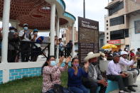 FILE - Supporters of President-elect Pedro Castillo watch a live broadcast of his swearing-in ceremony at a public square in Tacabamba, Peru, located in the Cajamarca department where Castillo is from, July 28, 2021. His supporters hoped Castillo, a populist outsider of humble roots, would redress their plight — or at least end their invisibility.But during 17 months in office before being ousted and detained Wednesday, supporters instead saw Castillo face the racism and discrimination they often experience. (AP Photo/Francisco Vigo, File)