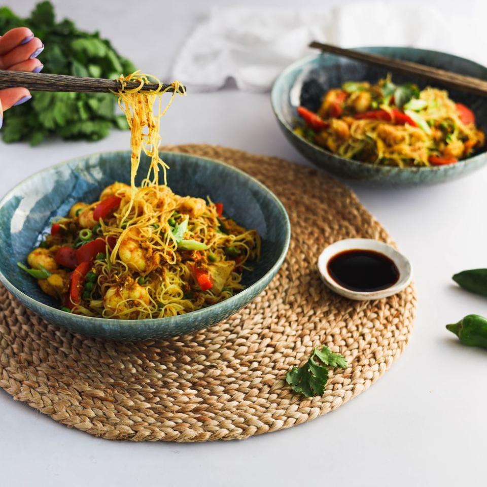 <p>Singapore noodles is a Chinese takeaway classic. Complete with king prawns, shiitake mushrooms and frozen peas, this super-simple <a href="https://www.delish.com/uk/cooking/recipes/a30607809/chicken-broth/" rel="nofollow noopener" target="_blank" data-ylk="slk:noodle;elm:context_link;itc:0;sec:content-canvas" class="link ">noodle</a> recipe comes together in a matter of minutes! </p><p>Get the <a href="https://www.delish.com/uk/cooking/recipes/a36227169/singapore-noodles/" rel="nofollow noopener" target="_blank" data-ylk="slk:Singapore Noodles;elm:context_link;itc:0;sec:content-canvas" class="link ">Singapore Noodles</a> recipe.</p>