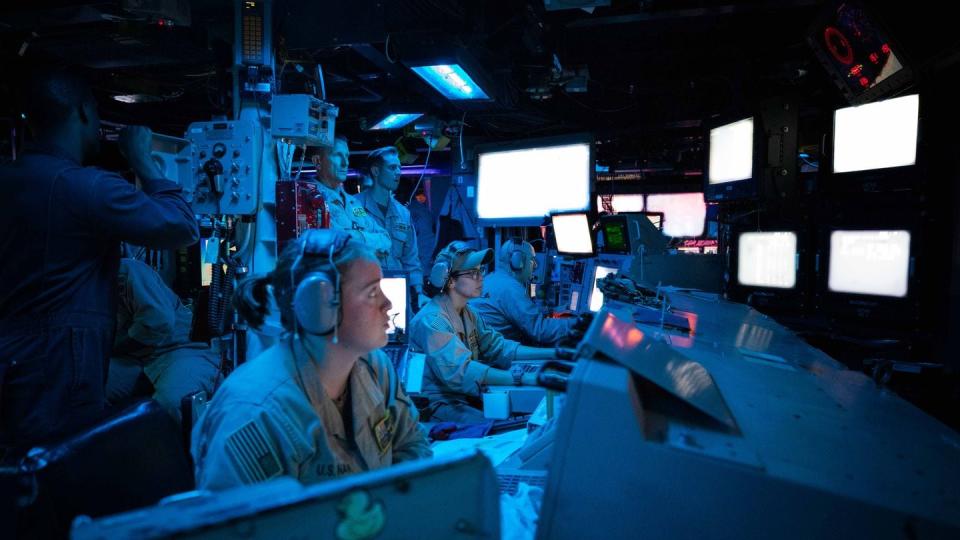 Sailors assigned to the Navy destroyer Carney stand watch in the ship’s Combat Information Center during an operation to defeat a combination of Houthi missiles and unmanned aerial vehicles on Oct. 19, 2023, in the Red Sea. (Mass Communication Specialist 2nd Class Aaron Lau/Navy)