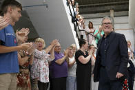 FILE - Labour leader Keir Starmer, right, arrives at Duchess China while on the General Election campaign trail, in Longton, Stoke, England, Thursday June 27, 2024. Red Wall - a string of seats in England’s midlands and north once dominated by mining, steelmaking and other heavy industries that traditionally voted Labour, whose traditional color is red. After years of high unemployment and social decay, many of these voters switched to the Conservatives under Boris Johnson. Labour hopes to regain many of these seats on Thursday, July 4. (Stefan Rousseau/PA via AP, File)