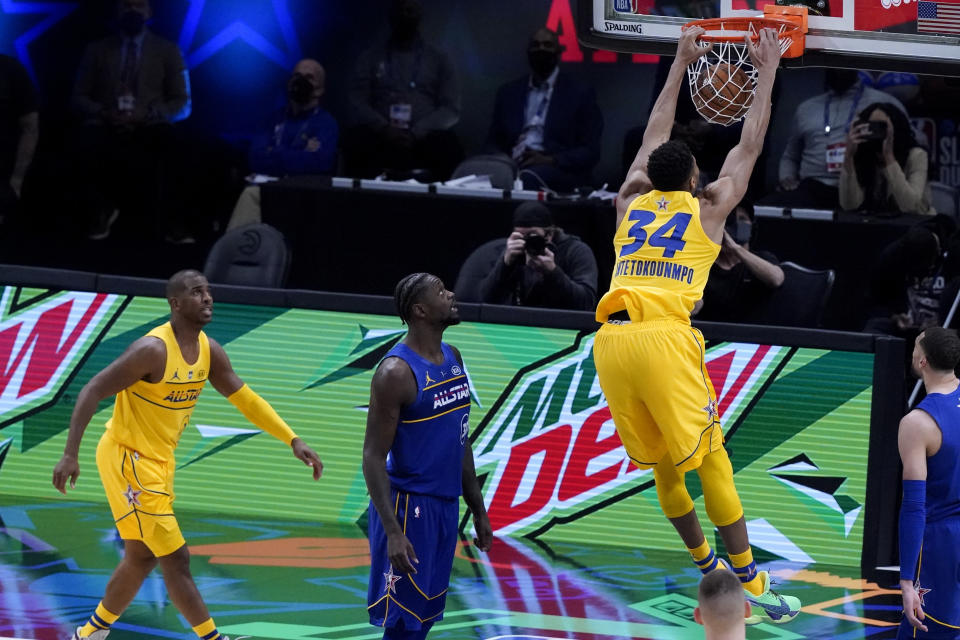 Milwaukee Bucks forward Giannis Antetokounmpo dunks during the first half of basketball's NBA All-Star Game in Atlanta, Sunday, March 7, 2021. (AP Photo/Brynn Anderson)