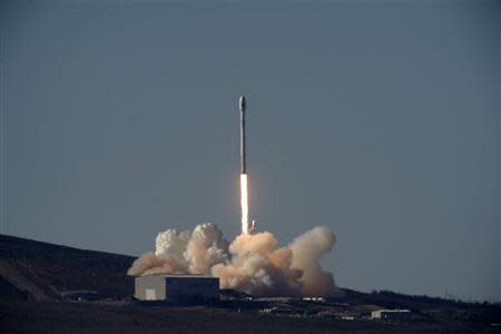 A Falcon 9 rocket carrying a small science satellite for Canada is seen as it is launched from a newly refurbished launch pad in Vandenberg Air Force Station September 29, 2013. REUTERS/Gene Blevins