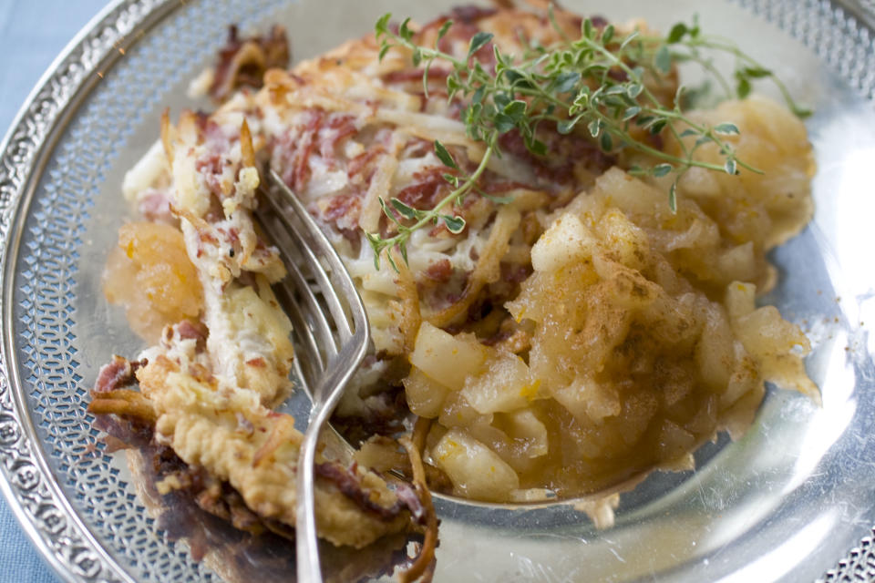 This Oct. 7, 2013 photo shows latke crusted turkey cutlet and Meyer lemon applesauce. (AP Photo/Matthew Mead)