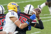 Pittsburgh defensive lineman Nate Temple (16) knocks the ball away as Austin Peay quarterback Kam Williams (15) throws an incomplete pass during the second half of an NCAA college football game Saturday, Sept. 12, 2020, in Pittsburgh. (AP Photo/Keith Srakocic)