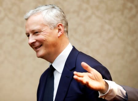 France's Finance Minister Bruno Le Maire is escorted by Japan's Finance Minister Taro Aso at the start of their meeting at the Finance Ministry in Tokyo