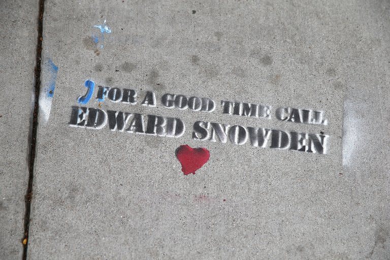 Graffiti stenciled on the sidewalk on June 11, 2013 in San Francisco, California refers to Edward Snowden, the former US intelligence contractor who revealed the extent of US phone and Internet surveillance